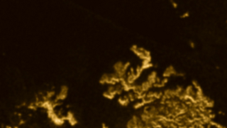Illustration for article titled A Mysterious "Magic Island" Has Appeared On Titan
